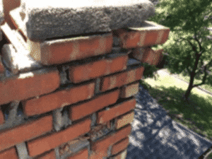 Storm damage of chimney crown before rebuild Storm damage of chimney crown before rebuild