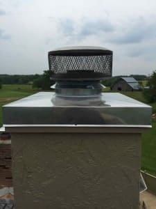 Prefab chimney chase cover after new stainless steel chimney cover is installed