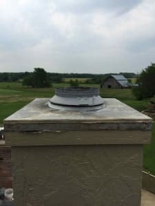 Prefab chimney chase cover before new stainless steel chimney cover is installed