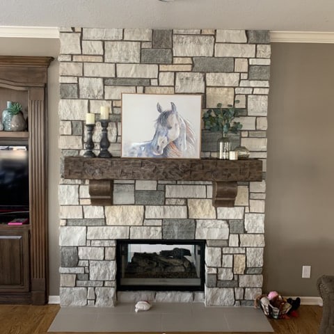 Stone Fireplace Surround with Wooden Mantel and horse painting