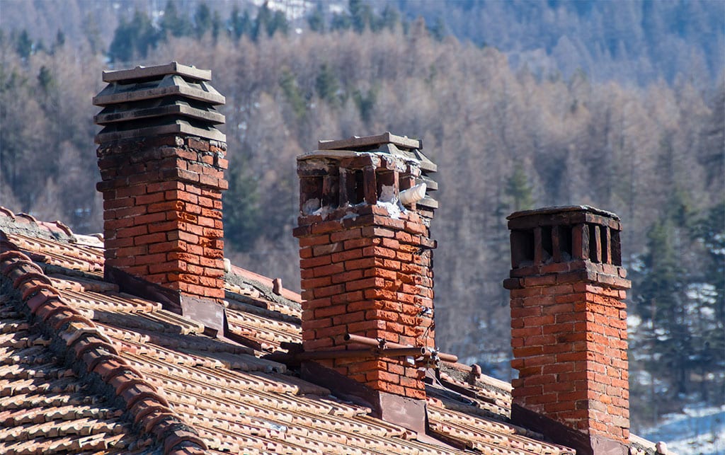 Red clay tile roof and brick smoke stack