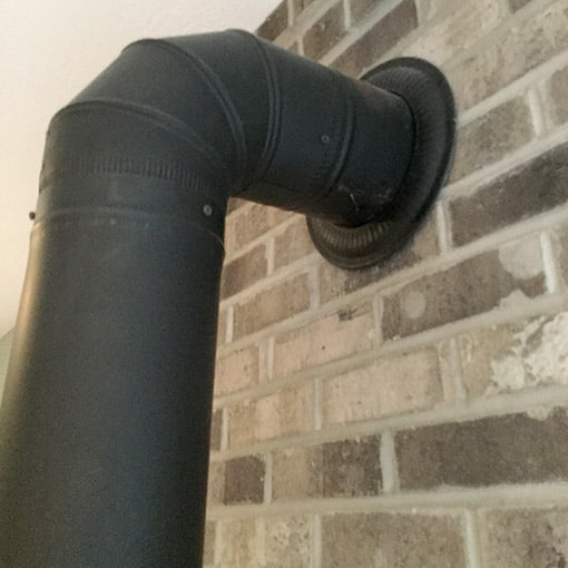 Wood Stove Pipe into Brick Surround Wall