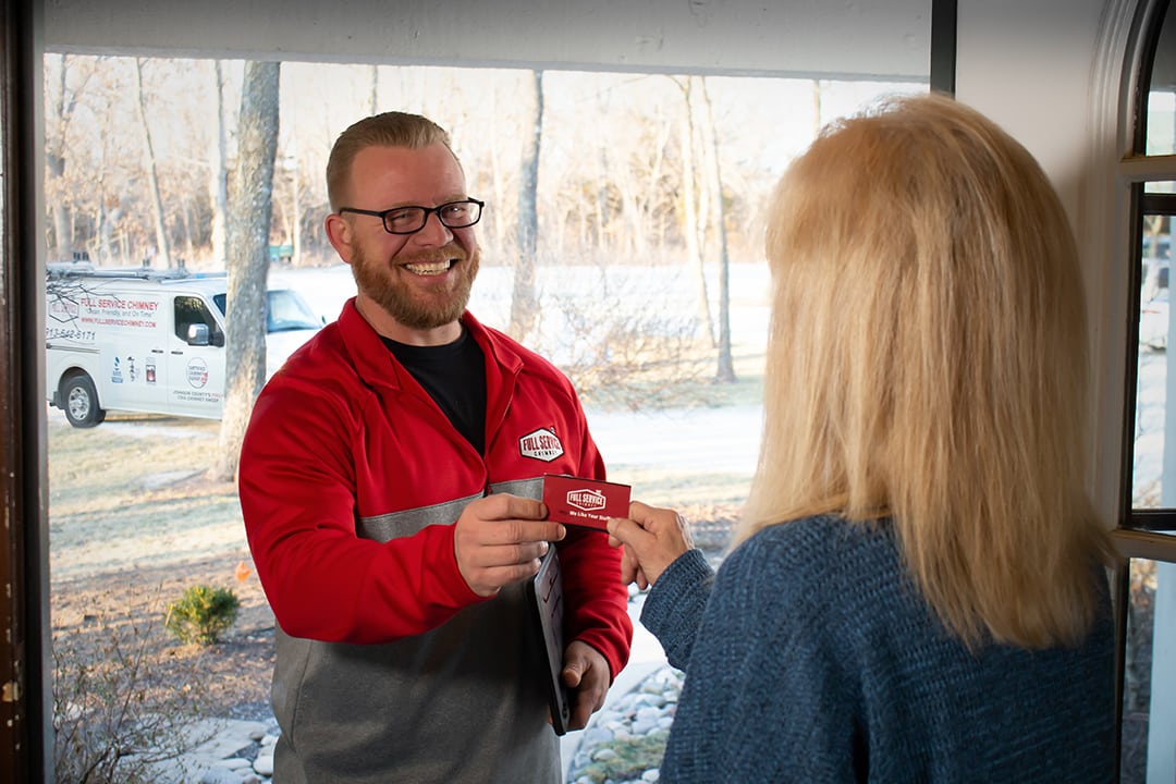 Full Service Chimney sweep greets customer with business card