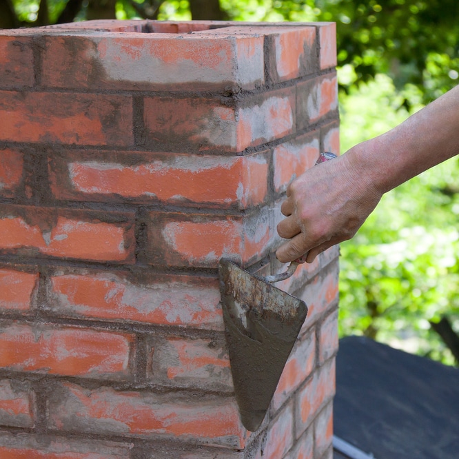 Man Repairing Chimney